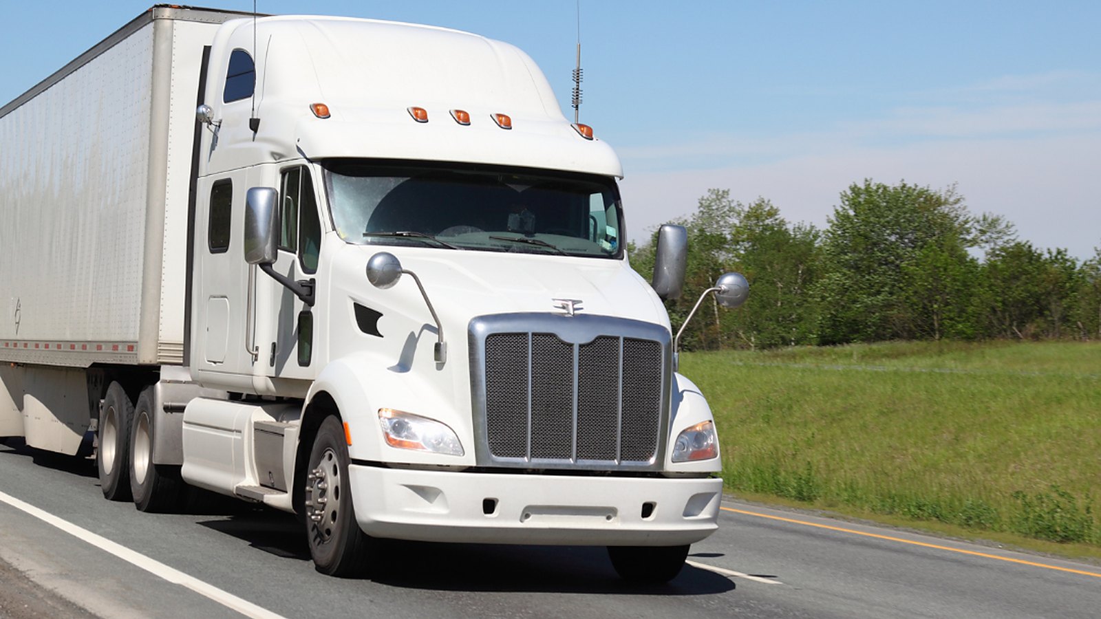 Truckload rig rolling out on a time-critical run